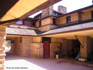 Looking (plan) southeast in Taliesin's "Work Court". In view: stone, roofing, plaster and windows in the courtyard.