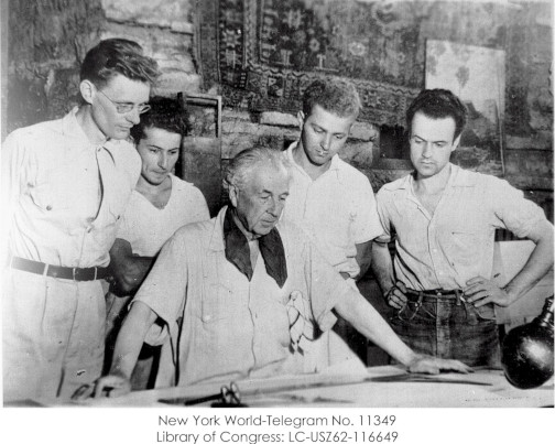 Frank Lloyd Wright in his studio with 4 apprentices in the Taliesin Fellowship.