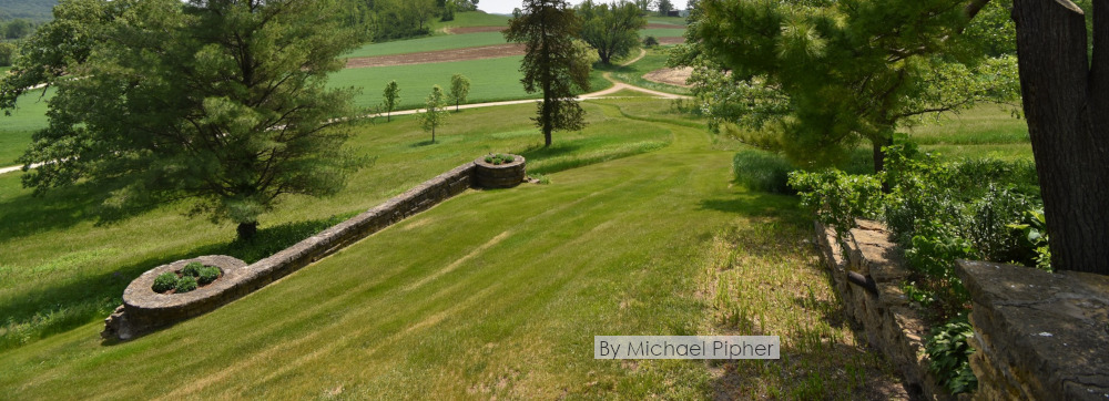 Exterior photograph taken at Taliesin showing stone retaining wall. Taken by Michael Pipher.